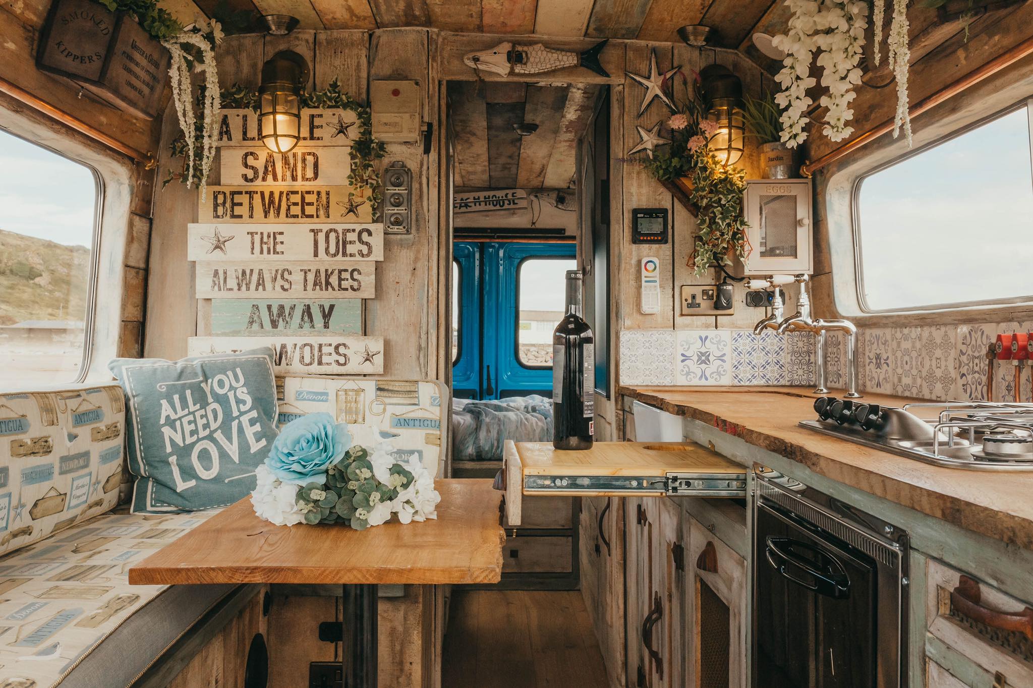interior view of ernie by supertramped campervan kitchen with wine rack
